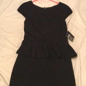 Classy black peplum style dress.